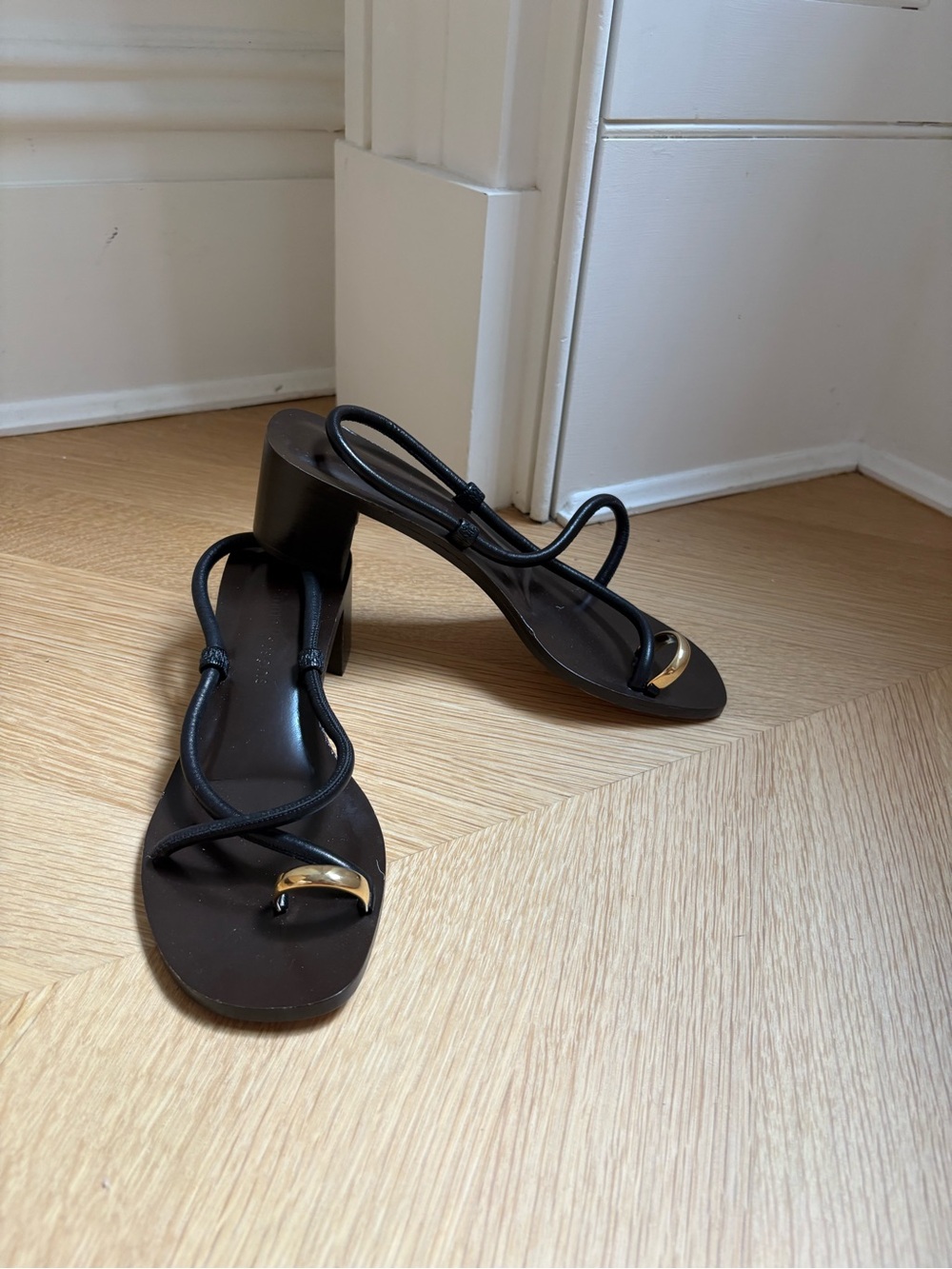 Emme Parsons Black Strappy Mid-Heel Sandals with Gold Toe Accent